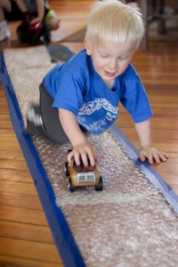 child playing on bubble wrap