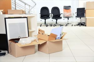 office supplies packed into cardboard boxes