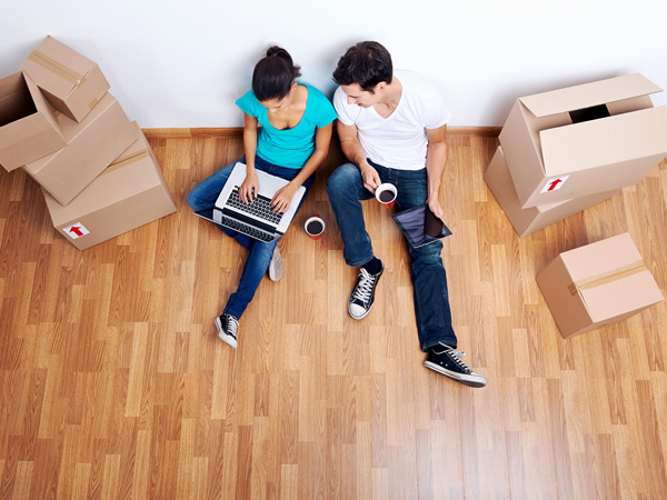 Couple on Floor With Moving Boxes