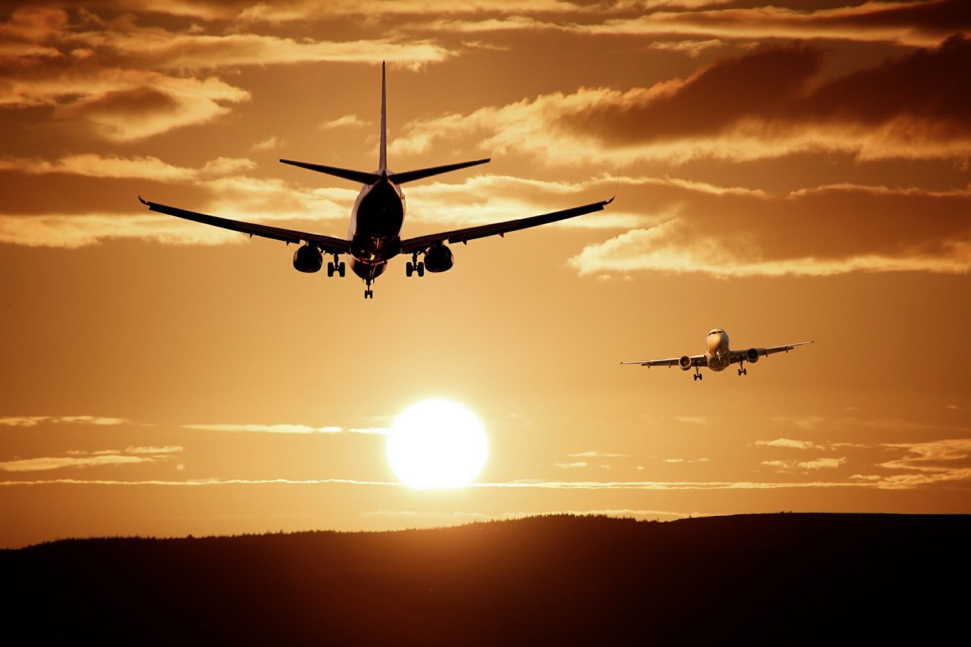 Planes Flying With Sunset Behind