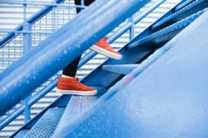 woman walking up steps