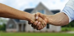 neighbors shaking hands