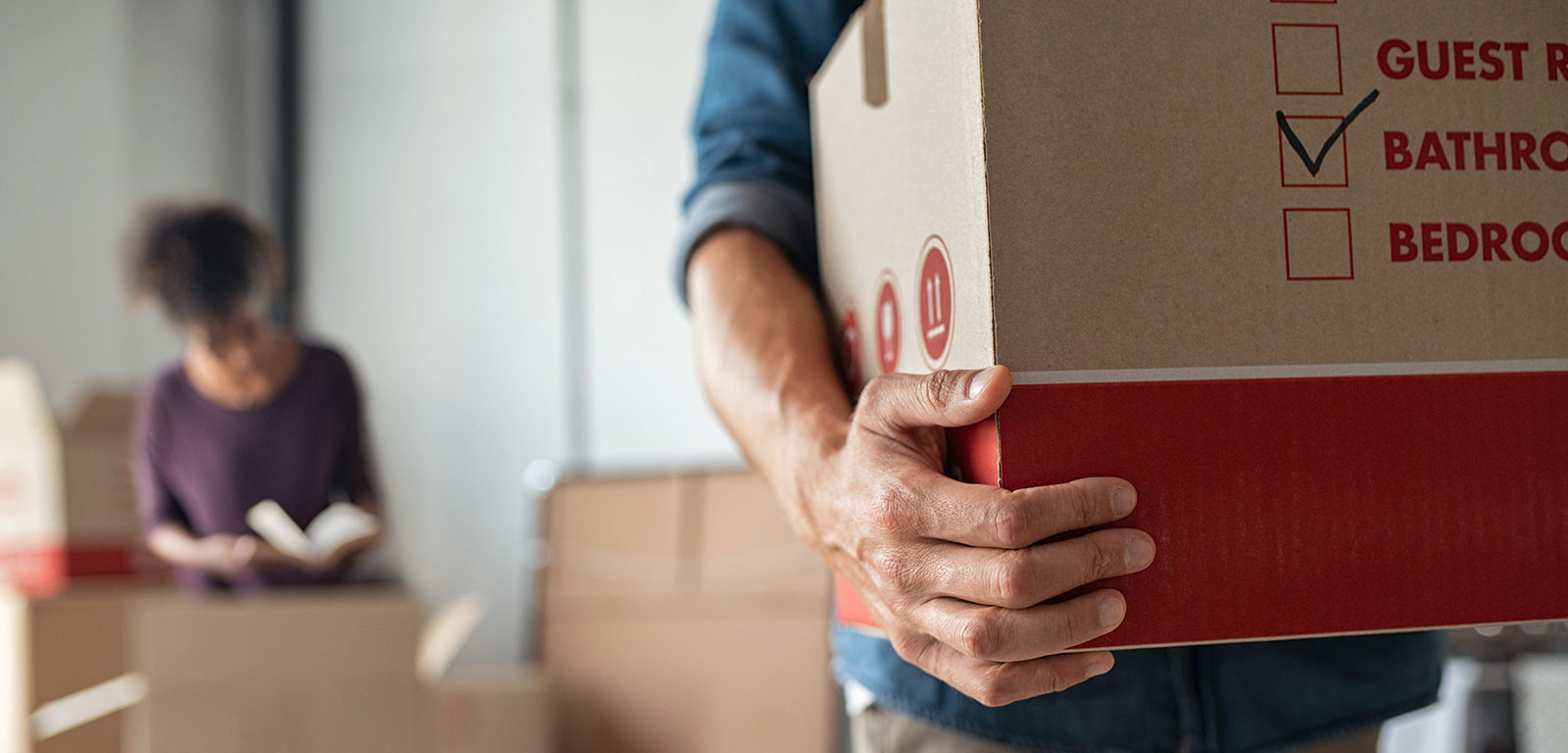 holding cardboard box for moving day