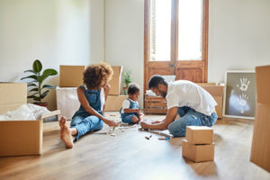 A young family unpacking boxes