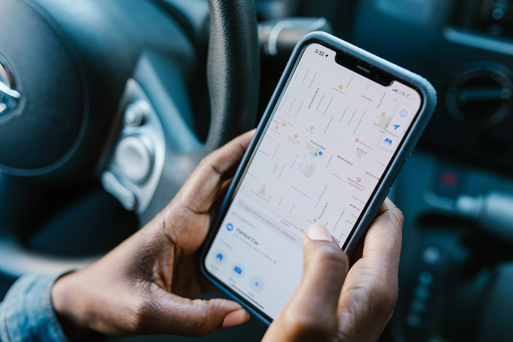 A woman looking at a Maps app on her phone