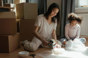 Woman and child packing fragile items